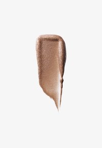 Vloeibare bronzen highlighter met een metallic glansafwerking. Zachte textuur, licht schuine vorm en een warme, middelgrote bronzen kleur.