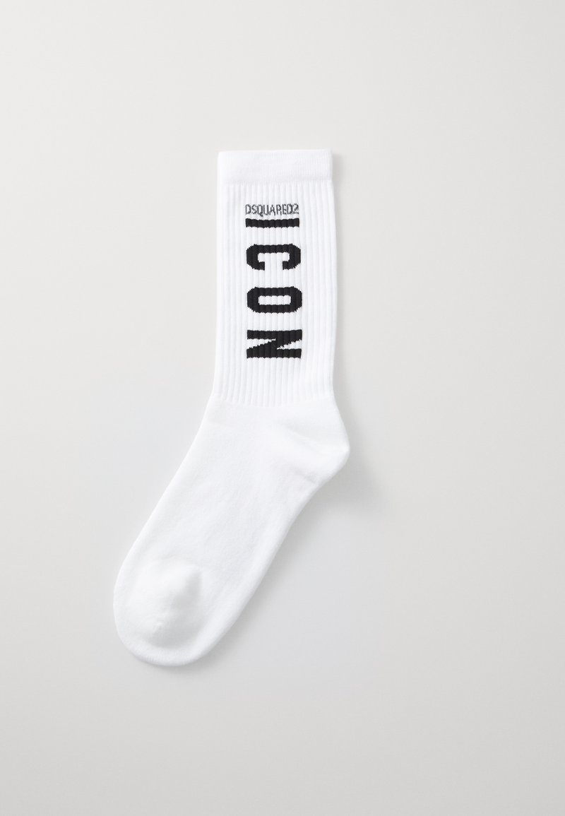 White cotton socks with ribbed design. Black "ICON" text and "DSQUARED2" logo woven near the top. Smooth texture, ankle-length.