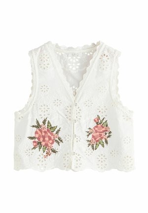 Blouse blanche sans manches boutonnée avec motifs floraux découpés et bouquets de fleurs roses brodés à l'avant, bords festonnés aux manches et à l'ourlet.