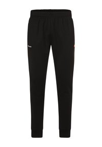 Pantalones de chándal negros con cintura elástica, perneras ajustadas y bolsillos laterales. Presenta un logo en blanco y un acento en naranja. Textura de tela suave.