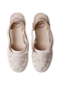 Beige, woven fabric espadrilles featuring cross straps, a round toe, and a textured jute sole. Inner lining in a light, natural color.