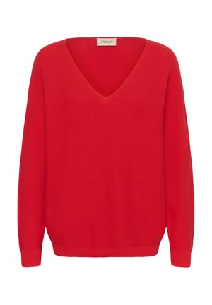 Červený sveter so špicatým výstrihom, dlhými rukávmi, rebrovanou štruktúrou a voľným strihom. Na štítku vzadu na krku je nápis „CREAM“.