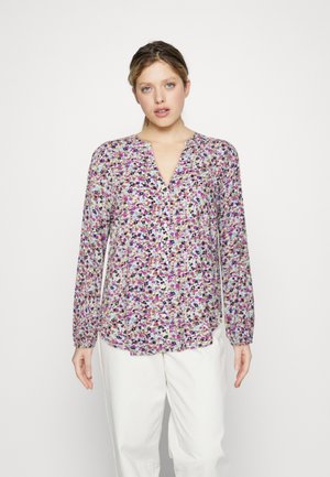 Langärmlige Bluse mit floralen Mustern, V-Ausschnitt und buntem Blumenmuster in lila, grün und schwarz, aus leichtem Stoff gefertigt.