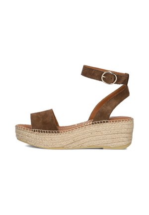 Brown suede platform sandal with ankle strap and buckle, thick woven jute sole, open toe design, side view on white background.