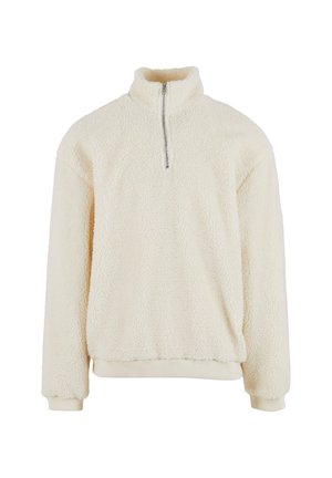 Fleece pullover in roomkleur, met een hoge kraag en een halve rits. Getextureerd oppervlak met ribgebreide manchetten en zoom. Casual, ontspannen pasvorm.