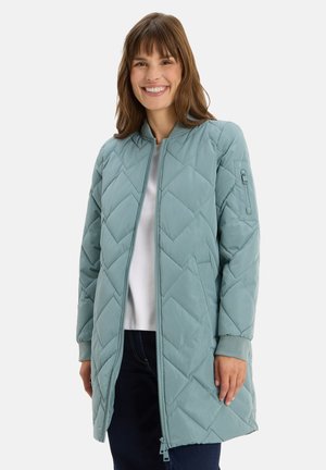 Light blue quilted jacket with a bomber style, featuring a zip front, ribbed cuffs, and a side pocket. Smooth texture and mid-length design.