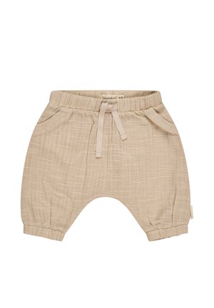 Beige children's shorts made of textured fabric, featuring an elastic waistband, drawstring, and side pockets with gathered cuffs.