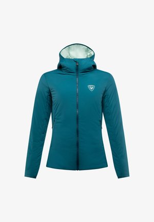 Teal-värinen eristetty takki huppulla, jossa on täysipitkä vetoketju, sivutaskut ja logo rinnassa. Pehmeä, kevyt kangas.