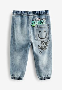 Next GRAFFITI - Laza szabású farmerek - light blue denim