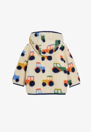 Geacă din fleece cu un fundal crem, având modele colorate de tractoare în bleu, roșu, verde și portocaliu. Vine cu glugă și manșete cu model în valuri.