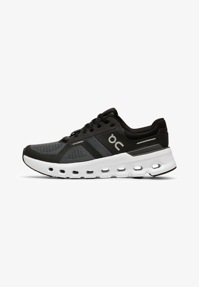 Black and grey athletic shoe featuring a mesh upper, cushioned white midsole with hollowed-out sections, and black rubber outsole.