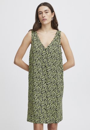 Blumenkleid mit V-Ausschnitt, ärmellosem Design und schwarzem Hintergrund. Verfügt über kleine grüne und weiße Blumenmuster überall.
