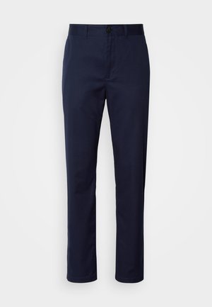 Pantalones azul marino de mezcla de algodón. Presenta una pierna recta, una cinturilla con pasadores para cinturón y un cierre frontal con botón.