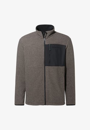 Kurtka polarowa w brązowym, teksturowanym materiale z czarną kieszenią na suwak na piersi i wysokim kołnierzem. Posiada zamek błyskawiczny z przodu i elastyczne mankiety.