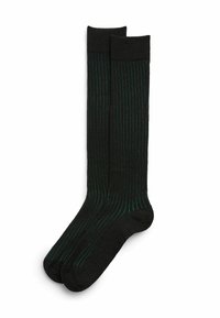 Czarne skarpetki do kolan z cienkimi zielonymi pionowymi paskami, gładką teksturą i wygodnym ściągaczem na górze.