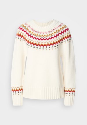 Cream sweater with a ribbed neckline and hem. Features a colorful zigzag pattern in red, gold, and green around the shoulders and sleeves.