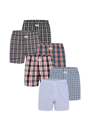 Six pairs of men's boxer shorts in various plaid and striped patterns arranged in two columns on a white background.