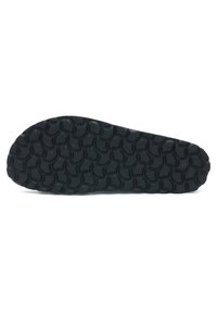 Semelle de chaussure en caoutchouc noir avec un motif ondulé et texturé, conçu pour l'adhérence et la stabilité. Les bords se rétrécissent vers l'orteil.