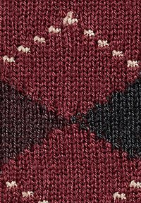 Dziane tkaniny w odcieniach burgundowym i czarnym z geometrycznym wzorem, z teksturowaną przędzą i małymi białymi akcentami.