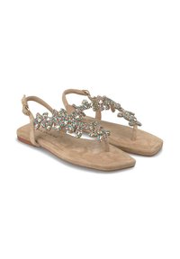 Sandali di suede beige con suola piatta e una fascia decorativa adornata con strass multicolori in motivi floreali.