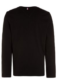 Black long-sleeve T-shirt with a round neckline and a small tri-color tag at the back. Soft cotton fabric, plain design without patterns.