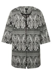 Giacca a maniche corte a pattern bianco e nero, con scollatura a V e motivi decorativi paisley, caratterizzata da un fit comodo e una sottile texture.