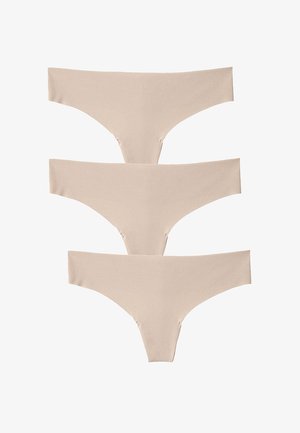 Tre paia di biancheria intima senza cuciture color beige sono impilati. Il tessuto è liscio con una texture opaca e presenta un design minimalista e senza cuciture visibili.