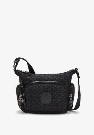 Black crossbody bag made of textured nylon, featuring a patterned surface, a front zip pocket, and a decorative charm on the zipper pull.