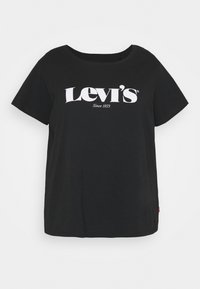 Camiseta de algodón negra con mangas cortas, cuello redondo y logo blanco de 'Levi’s' en el pecho. Corte recto y textura suave. Etiqueta de logo roja en el lateral.