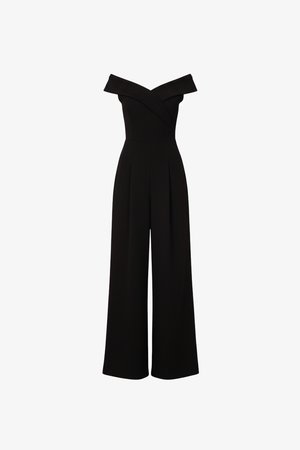 Tuta nera con scollo a barca, pantaloni a gamba larga e corpetto aderente con dettaglio incrociato sul collo.