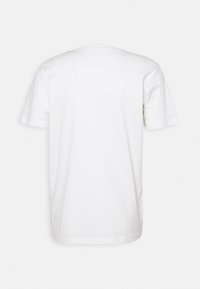 White cotton t-shirt with short sleeves, a round neckline, and a rectangular patch detail on the upper back. Soft, smooth texture.