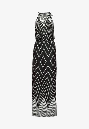 Maxi-jurk in zwart en wit, met een halternek, elastische taille en een zigzag diamantpatroon. Glad, lichtgewicht stof zorgt voor een vloeiende uitstraling.