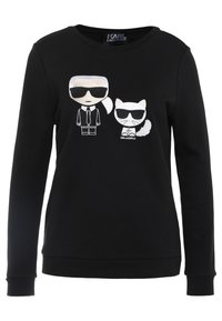 Sudadera negra de manga larga con un gráfico de dibujos animados de una figura y un gato, ambos con gafas de sol. Detalles bordados en blanco.