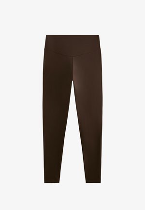 Bruna leggings gjorda av elastiskt material; hög midja med sömdesign; slät textur; full längd till vristen.