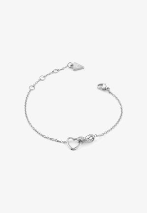 Braccialetto in argento con un design a infinito e cuore, decorato con piccole pietre trasparenti e un'etichetta a forma di triangolo.