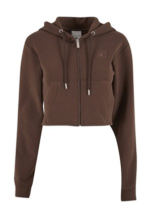 Trumpintas rudos spalvos gobtuvas iš minkštos medžiagos, su priekinio užtrauktuko, dviem kišenėmis ir raišteliais su metalinėmis galvutėmis. Ant krūtinės siuvinėtas logotipas.