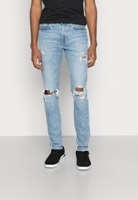 Levi's® SKINNY TAPER - Calças de ganga de corte skinny - lefkas moonlit