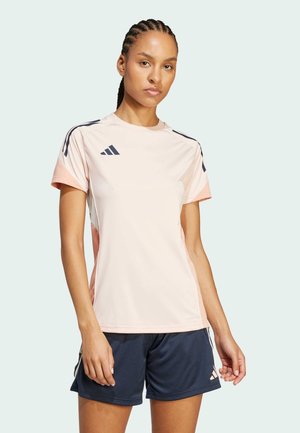 Roz roze majice za sport s mornarskim naglascima i kratkim rukavima, izrađena od laganog materijala. Majica ima okrugli izrez i logotip.