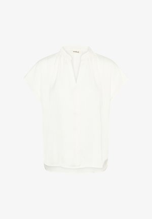 Bluză albă cu mâneci scurte, guler mandarin, material ușor texturat și croială lejeră, cu tiv drept și crăpături laterale.