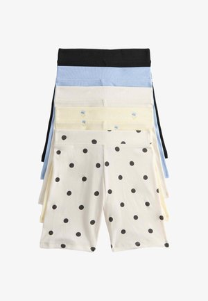 Fem par ribstrikkede shorts stablet, i farverne sort, blå, creme, lys gul med små blomster og hvid med sorte prikker.