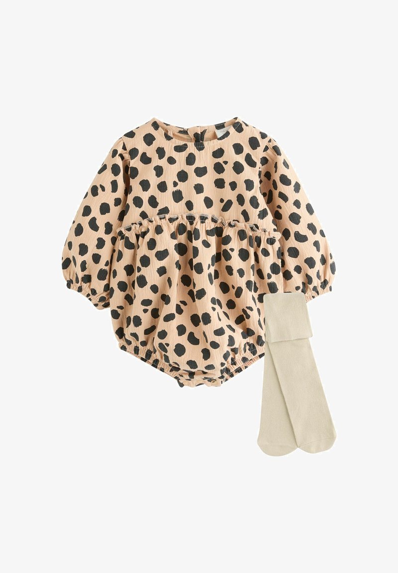Cotton romper in peach with black leopard spots, featuring puff sleeves and an elasticized waist, accompanied by beige tights.
