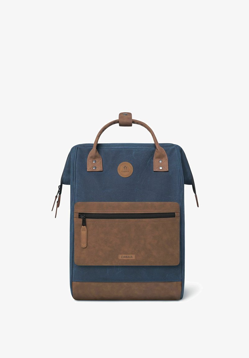 Backpack made of dark blue fabric with brown leather accents, featuring a front zipper pocket and top handle for carrying.