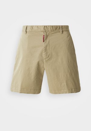 Beige cotton shorts with a flat front, button closure, and belt loops. Features subtle texture and a small red brand label on the waistband.