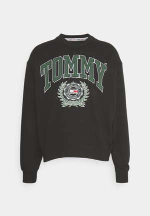 Schwarzer Sweatshirt mit Rundhalsausschnitt, grünem "TOMMY"-Schriftzug und rundem Tommy Jeans-Logo mit Lorbeerkranz auf der Vorderseite.