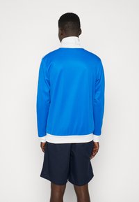 adidas Originals Majica s kapuljačom i patentnim zatvaračem - blue bird/white