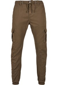 Bruna cargobyxor av bomull, med dragsko i midjan, sidfickor och avsmalnande muddar, med en slät, enfärgad textur.