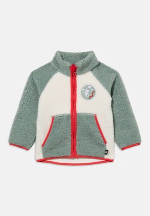 Zachte groene en witte kinderjas met ritssluiting, rode rits en rand van de zak, met een kleine ronde patch met een vogel- en wormontwerp.