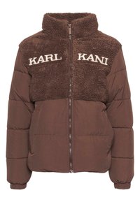Brun oppustelig jakke med øverste del i faux pels, høj krave og broderet "KARL KANI" tekst. Lynlåslukning og elastiske manchetter.