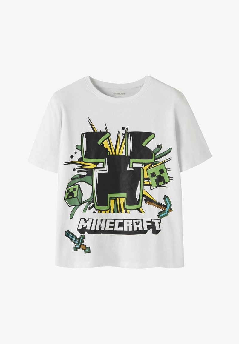 T-shirt blanc avec un grand visage de Creeper Minecraft, une épée pixelisée, une pioche et le mot Minecraft en lettres majuscules sur le devant.