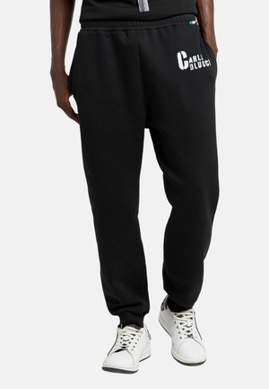Pantalon de survêtement - schwarz
